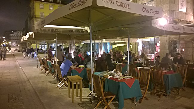 The Cais da Ribeira waterfront cafe at night