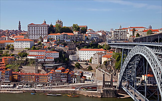 The Cais da Ribeira waterfront is next to the King Luis I wrought iron bridge