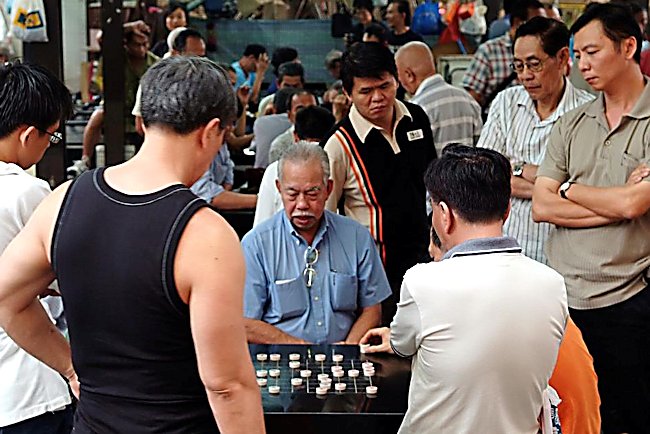 Locals playing games in Chinatown Singapore